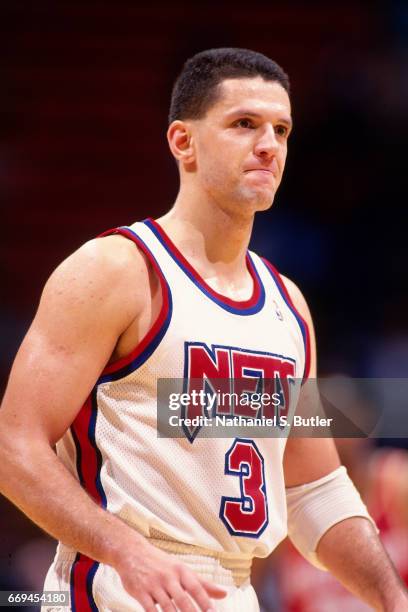 Drazen Petrovic of the New Jersey Nets looks on against the Detroit Pistons during a game played circa 1993 at the Brendan Byrne Arena in East...