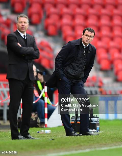 Doncaster Rovers manager Darren Ferguson, left, and Blackpool manager Gary Bowyer watch on from the sideline during the Sky Bet League Two match...
