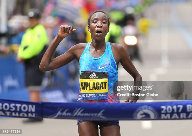 Edna Kiplagat, women's winner, crosses the finish line of the 121st Boston Marathon on April 17, 2017.