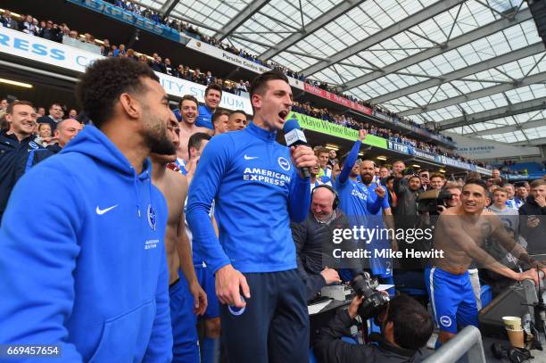 Lewis Dunk of Brighton celebrates with the fans at the end of the Sky Bet Championship match between Brighton & Hove Albion and Wigan Athletic at...