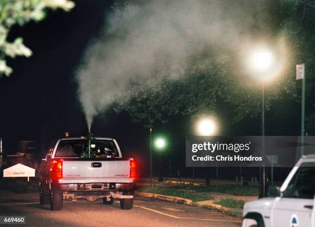 Private pest control company truck sprays insecticide July 19, 2000 in Staten Island, NY as part of New York efforts to control the mosquito-borne...