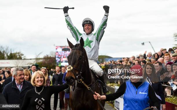 Meath , Ireland - 17 April 2017; Jockey Robbie Power celebrates as he enters the parade ring after winning the Boylesports Irish Grand National...