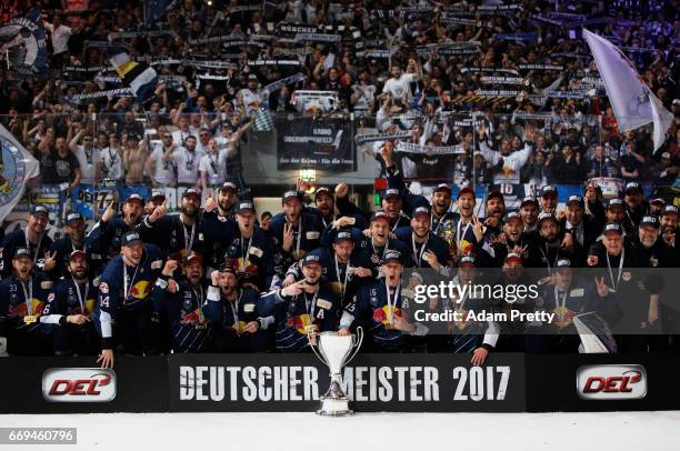 Jason Jaffray of Muenchen and his team mates celebrate winning the DEL Play-Offs Final Match 5 between EHC Muenchen and the Grizzlys Wolfsburg at...