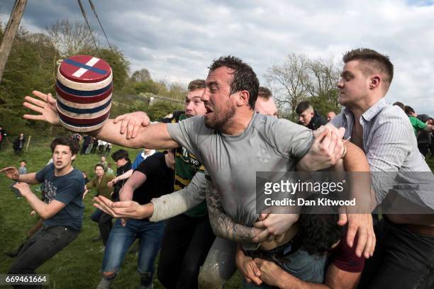 The second round of the bottle Kicking gets underway over the Hare Pie Hill on April 17, 2017 in Hallaton, England. Hallaton hosts the Hare Pie...