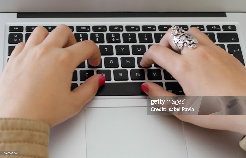 Top view of woman working on a laptop