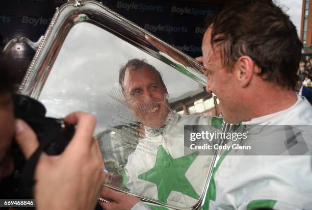 Meath , Ireland - 17 April 2017; Jockey Robbie Power celebrates with the plate after winning the Boylesports Irish Grand National Steeplechase on Our...