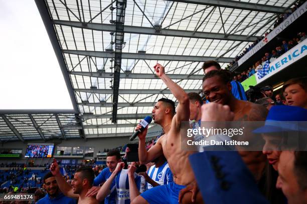 Beram Kayal of Brighton & Hove Albion celebrates with team-mates in the stands after victory in the Sky Bet Championship match between Brighton &...