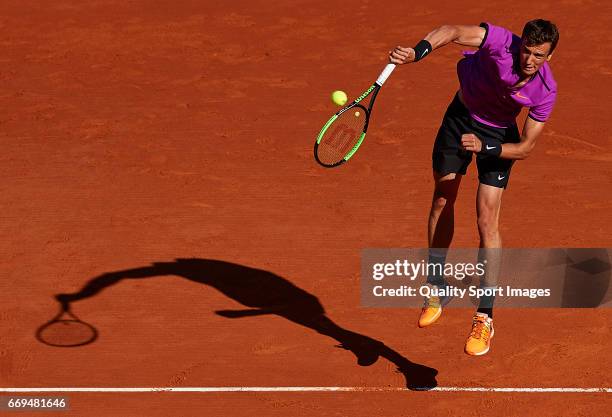 Andrey Kuznetsov of Russia serves during his match against Tomas Berdych of the Czech Republic during day two of the ATP Monte Carlo Rolex Masters...