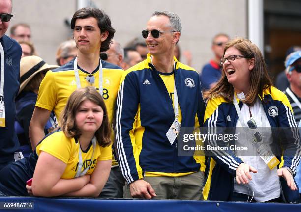Martin Richard's family, from left, Jane, Henry, Bill and Denise watch the 121st Boston Marathon at the finish line VIP stands on April 17, 2017....