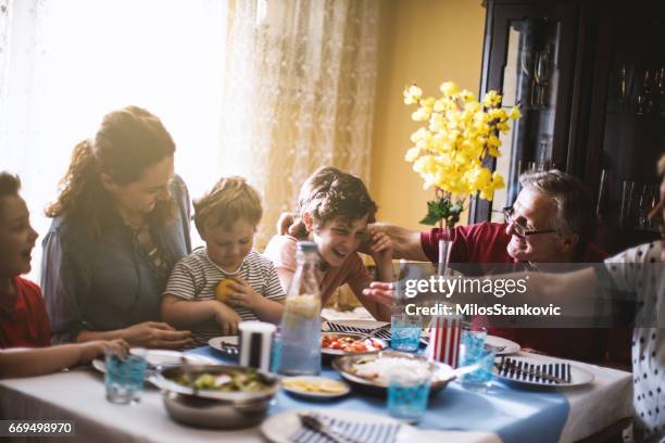 multi generation family dinner - dining table stock pictures, royalty-free photos & images