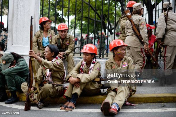 Members of the Bolivarian Militia take part in a parade in the framework of the seventh anniversary of the force, in front of the Miraflores...