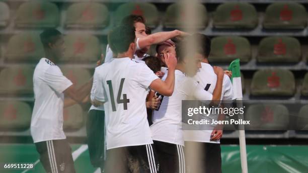 David Raum of Germany celebrates with his team mates after scoring his team's second goal during the international friendly between U19 Germany and...