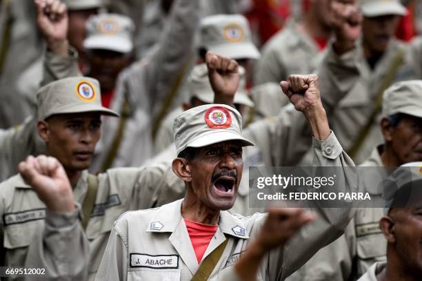 Members of the Bolivarian Militia take part in a parade in the framework of the seventh anniversary of the force, in front of the Miraflores...