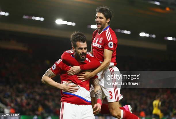 Alvaro Negredo of Middlesbrough celebrates as he scores their first goal with George Friend of Middlesbrough during the Premier League match between...