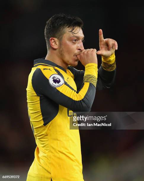 Mesut Ozil of Arsenal celebrates as he scores their second goal during the Premier League match between Middlesbrough and Arsenal at Riverside...