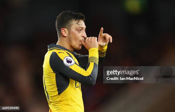 Mesut Ozil of Arsenal celebrates as he scores their second goal during the Premier League match between Middlesbrough and Arsenal at Riverside...