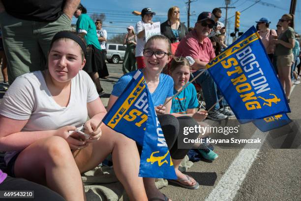 Spectators cheer the runners as they make their way past the 6 mile mark of the Boston Marathon on April 17, 2017 in Framingham, Massachusetts.