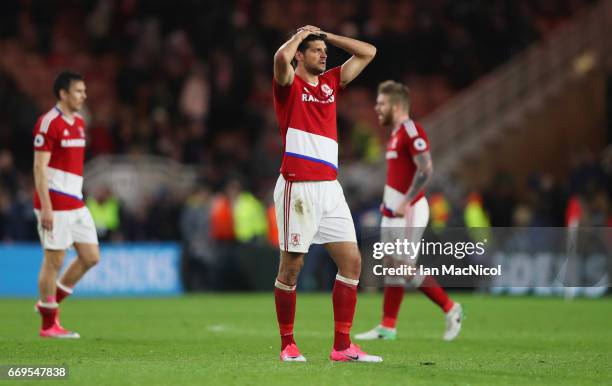 George Friend of Middlesbrough and team mates look dejected in defeat after during the Premier League match between Middlesbrough and Arsenal at...