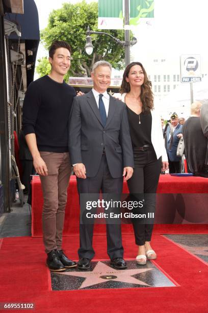Actors Daniel Henney, Gary Sinise and Alana de la Garza pose for a photo as Gary Sinise is honored with a Star On The Hollywood Walk Of Fame on April...