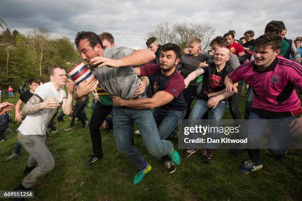 The second round of the bottle Kicking gets underway over the Hare Pie Hill on April 17, 2017 in Hallaton, England. Hallaton hosts the Hare Pie...