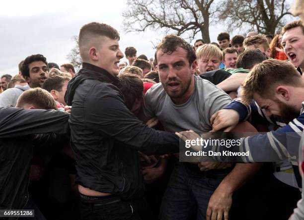 The second round of the bottle Kicking gets underway over the Hare Pie Hill on April 17, 2017 in Hallaton, England. Hallaton hosts the Hare Pie...