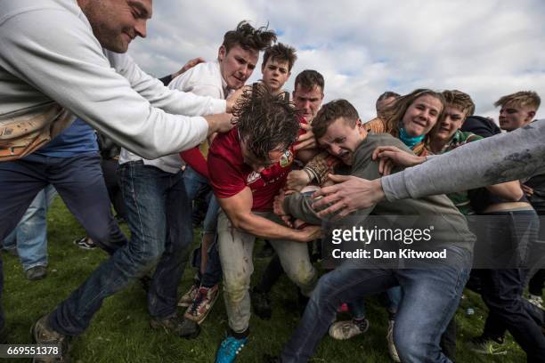 The second round of the bottle Kicking gets underway over the Hare Pie Hill on April 17, 2017 in Hallaton, England. Hallaton hosts the Hare Pie...