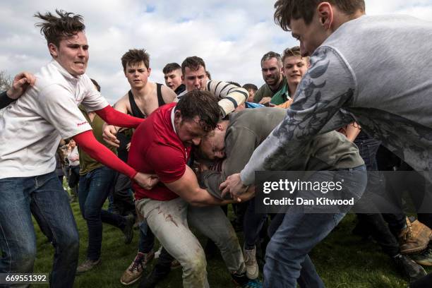 The second round of the bottle Kicking gets underway over the Hare Pie Hill on April 17, 2017 in Hallaton, England. Hallaton hosts the Hare Pie...