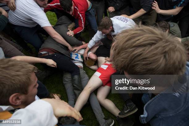 The second round of the bottle Kicking gets underway over the Hare Pie Hill on April 17, 2017 in Hallaton, England. Hallaton hosts the Hare Pie...