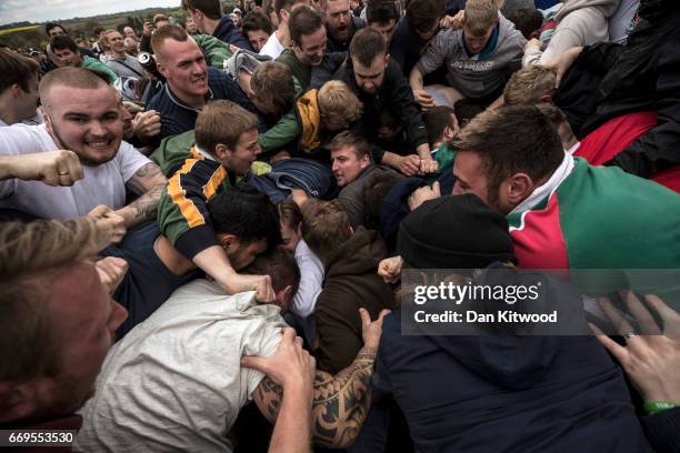 The second round of the bottle Kicking gets underway over the Hare Pie Hill on April 17, 2017 in Hallaton, England. Hallaton hosts the Hare Pie...