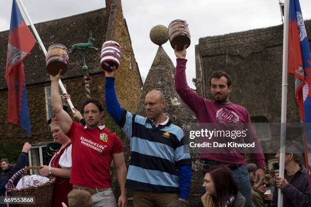 The Bottles are held aloft by members of the Hallaton team ahead of the bottle kicking on April 17, 2017 in Hallaton, England. Hallaton hosts the...