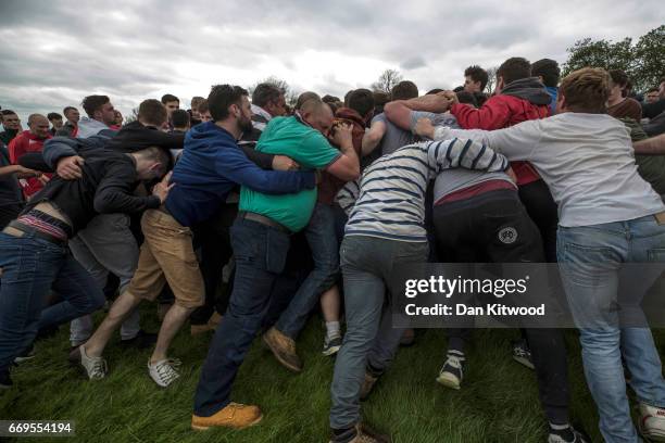 The bottle Kicking gets underway over the Hare Pie Hill on April 17, 2017 in Hallaton, England. Hallaton hosts the Hare Pie Scramble and Bottle...