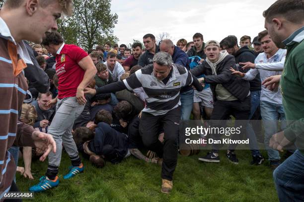 The bottle Kicking gets underway over the Hare Pie Hill on April 17, 2017 in Hallaton, England. Hallaton hosts the Hare Pie Scramble and Bottle...