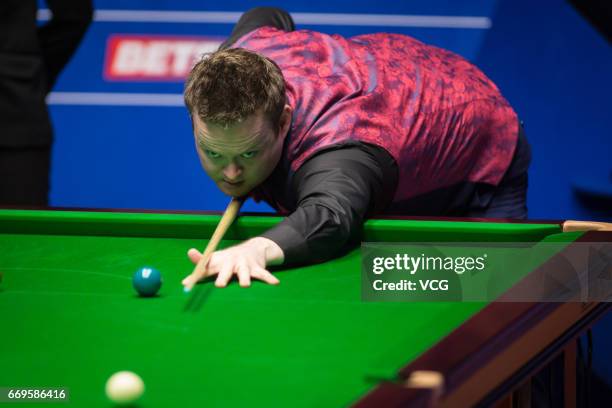 Shaun Murphy of England plays a shot during his first round match against Yan Bingtao of China on day three of Betfred World Championship 2017 at...