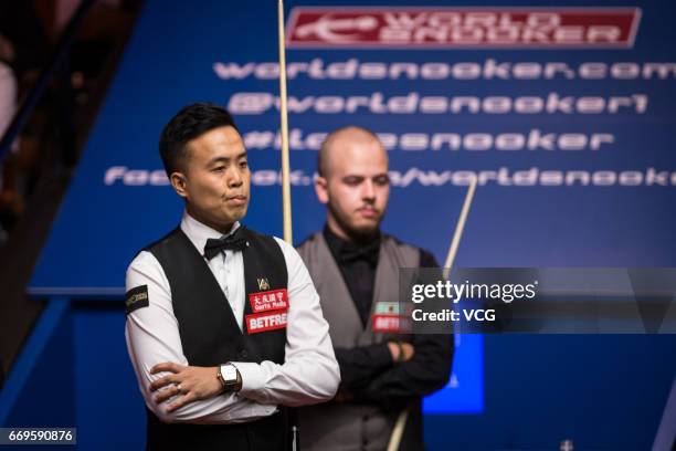 Marco Fu of Chinese Hong Kong reacts during his first round match against Luca Brecel of Belgium on day three of Betfred World Championship 2017 at...