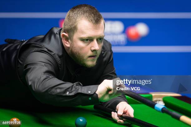 Mark Allen of Northern Ireland plays a shot during his first round match against Jimmy Robertson of England on day three of Betfred World...