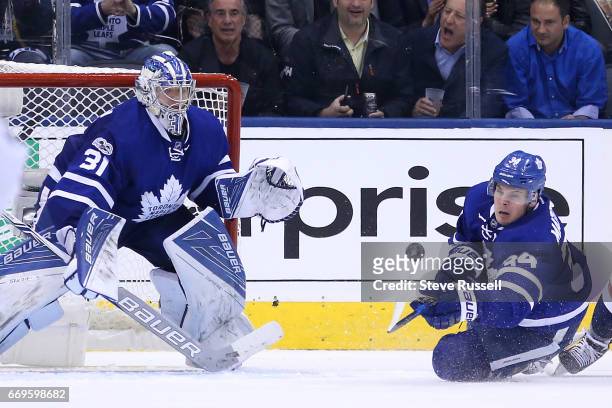 Toronto Maple Leafs center Nazem Kadri clears a loose puck in front of Frederik Andersen as the Toronto Maple Leafs play the Washington Capitals in...