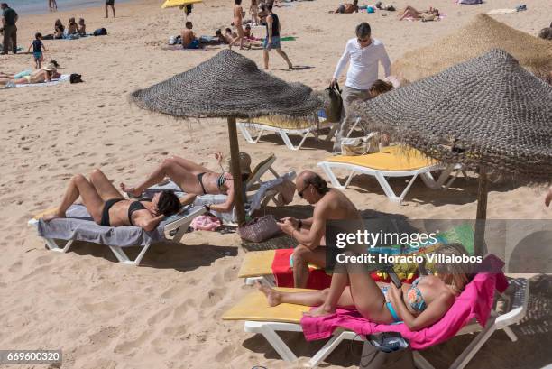 Beachgoers at Praia da Duquesa on April 16, 2017 in Cascais, Portugal. Although active all year round, Portuguese tourist industry is hoping for an...