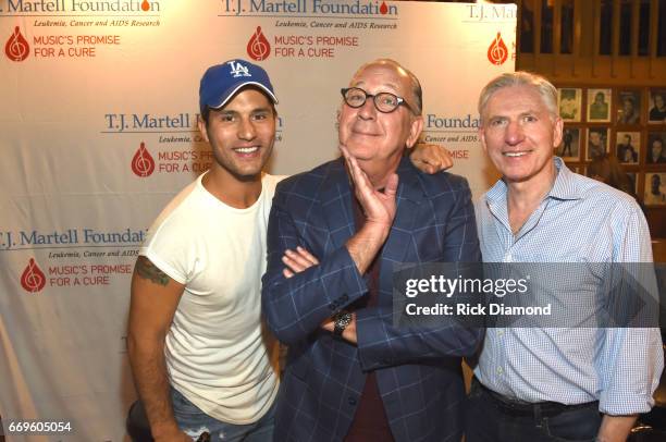 Musical artist Dan Smyers of Dan + Shay, Warner Music Nashville Chairman/CEO John Esposito and Attorney Ansel Daivs attend the T.J. Martell roast of...