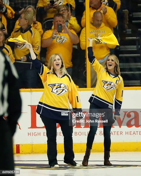 Nashville mayor Megan Barry, left, and country music singer Carrie Underwood excite the fans prior to Game Three of the Western Conference First...