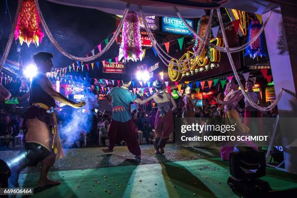 This photo taken on March 29, 2017 shows performers dancing during a staged event used to highlight a push by the city of Pattaya to promote safety...