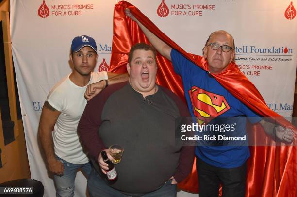 Musical artist Dan Smyers of Dan + Shay, comedian Ralphie May and Warner Music Nashville Chairman/CEO John Esposito take photos at the T.J. Martell...