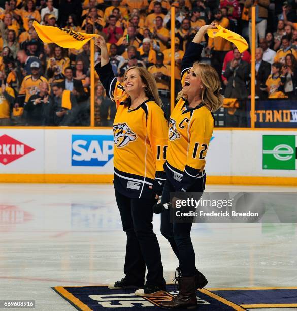 Nashville Mayor Megan Barry and singer Carrie Underwood wave rally towels prior to Game Three of the Western Conference First Round between the...