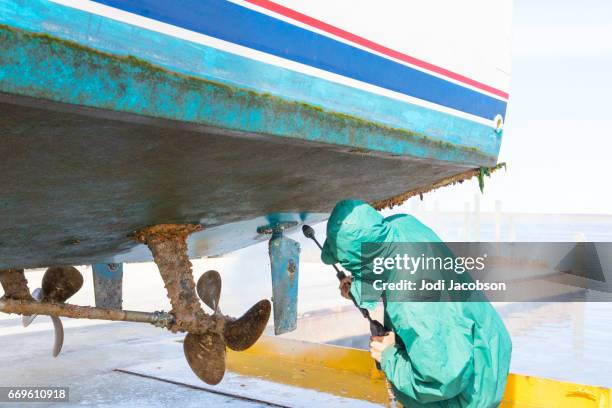 series:power washing barnacles on a yacht in dry dock - hull stock pictures, royalty-free photos & images