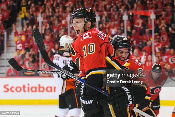 Kris Versteeg of the Calgary Flames celebrates with Sean Monahan after scoring against the Anaheim Ducks in Game Three of the Western Conference...