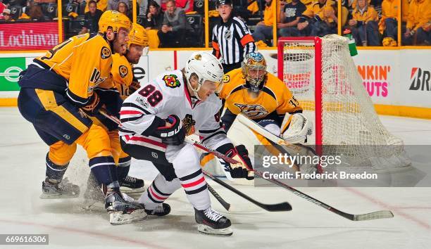 Mattias Ekholm of the Nashville Predators chases Patrick Kane of the Chicago Blackhawks during the second period in Game Three of the Western...