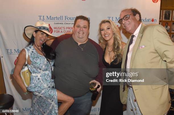 Guest, comedian Ralphie May, songwriter Misty Loggins and Adam Dread arrive at the T.J. Martell roast of Warner Music Nashville Chairman/CEO John...