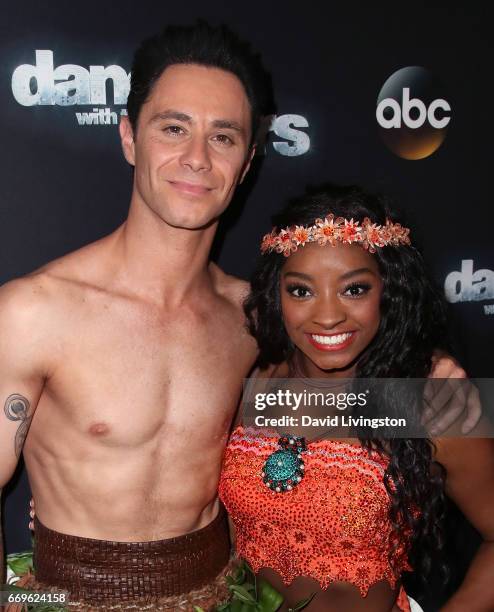 Olympian Simone Biles and dancer Sasha Farber attend "Dancing with the Stars" Season 24 at CBS Televison City on April 17, 2017 in Los Angeles,...