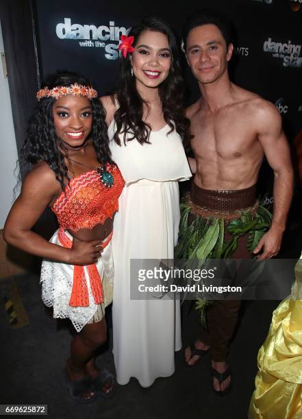Olympian Simone Biles and dancer Sasha Farber poses with singer Auli'i Cravalho at "Dancing with the Stars" Season 24 at CBS Televison City on April...