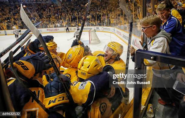 Kevin Fiala of the Nashville Predators celebrates his game winning overtime goal against the Chicago Blackhawks in Game Three of the Western...