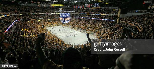 The Nashville Predators celebrate an overtime win against the Chicago Blackhawks in Game Three of the Western Conference First Round during the 2017...